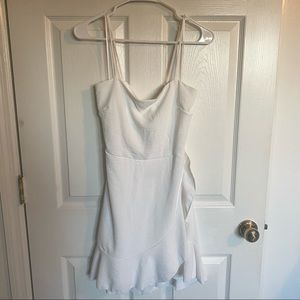 White boutique wrap dress perfect for bridal showers or bachelorette trips
